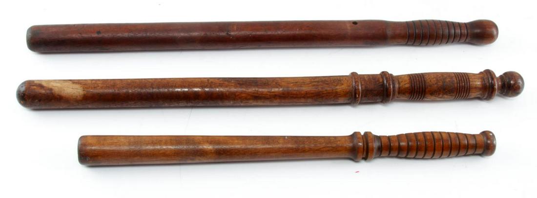 WOODEN ETCHED BILLY CLUB BATON LOT OF THREE: Wooden Etched Billy Club Baton Lot of Three. The lot includes three divergent sized billy clubs. One billy club measures 22 inches, another billy club measures 22.5 inches and the other one measures 1
