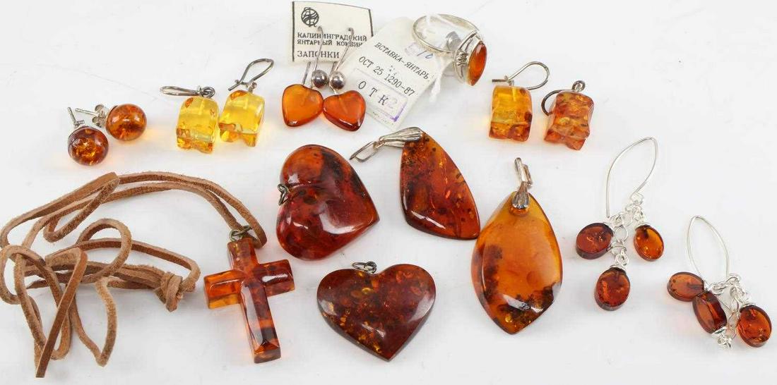 ASSORTED RUSSIAN AMBER ITEMS LOT 16: Assorted Russian Amber items lot 16. Contains various earrings, cross necklace, love heart pendants, ring. This lot has a reserve.
