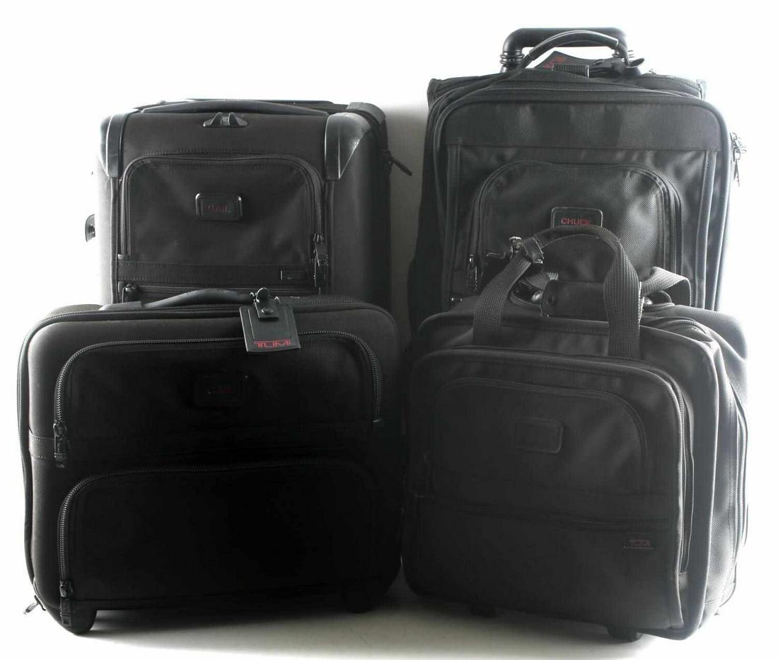 TUMI LUGGAGE LOT OF 4 WITH SPINNER CARRY PREOWNED: Lot includes: small spinner piece with rubber fittings (21.5 X 13 X 9 inches), one small roller piece (similar measurements), and two multi-compartment carry-on pieces (12 X 16 X 8 inches and similar)