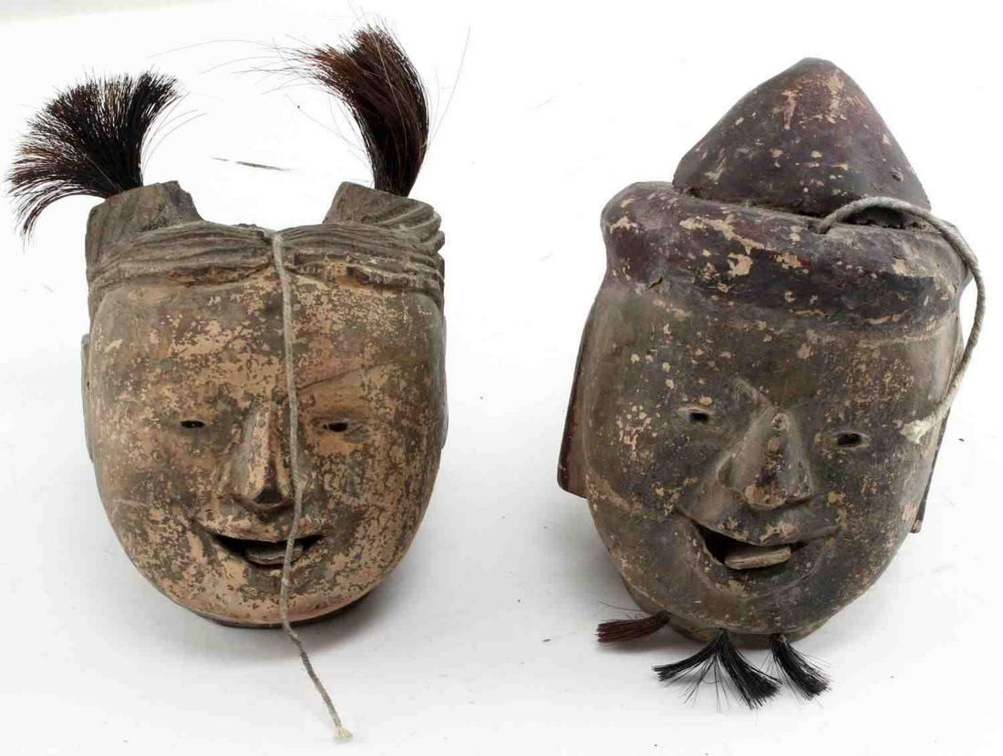 19TH CENTURY ASIAN CARVED WOOD PUPPET HEAD LOT: Pair of Asian 19th century hand carved, painted marionette puppet heads with motile tongue piece with string intact. 11cm x 20cm each. This lot has a reserve.