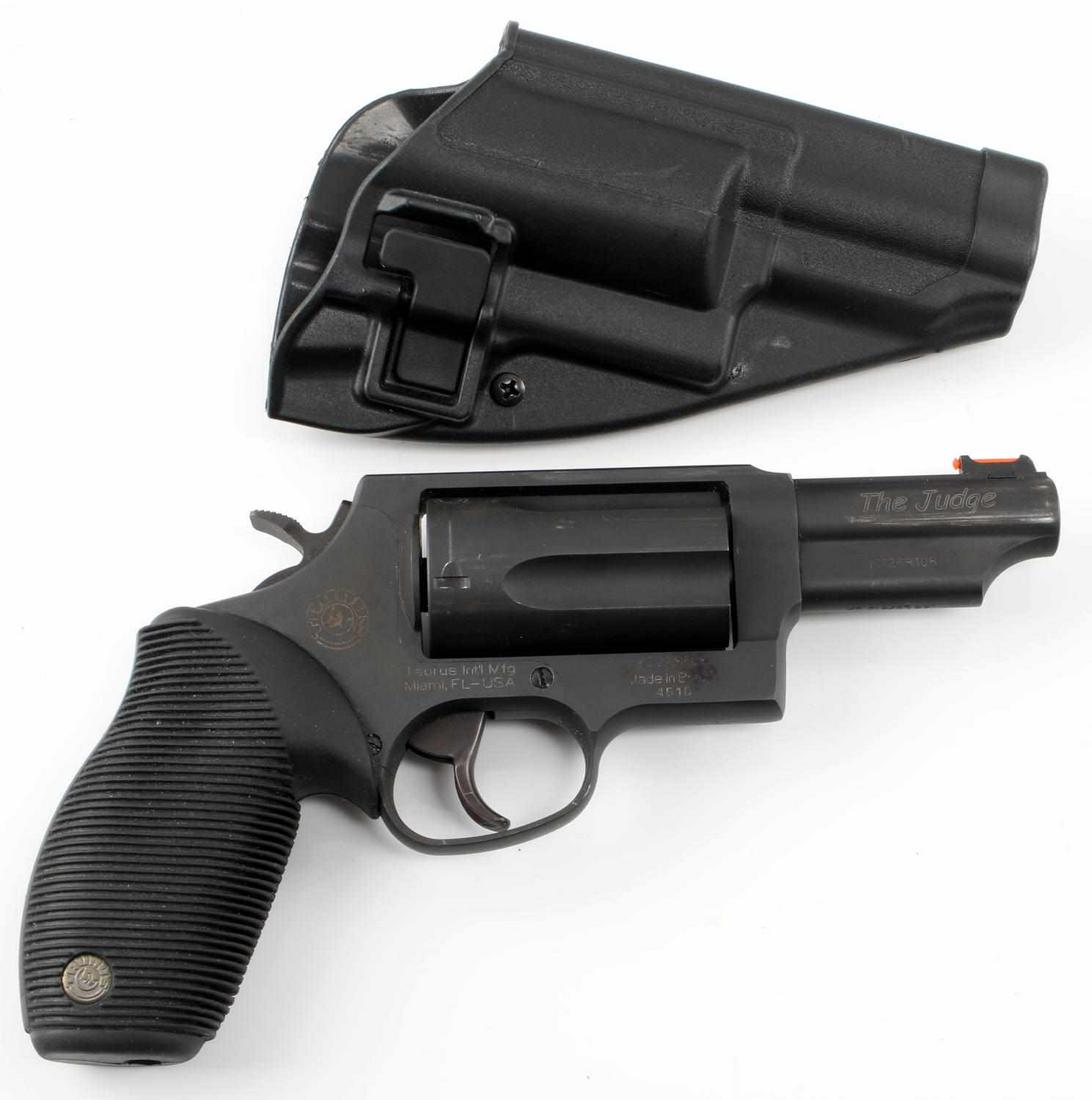 TAURUS THE JUDGE 5 SHOT REVOLVER .45 CAL W HOLSTER: Black matte finish, clear maker markings to right side frame and barrel, serial number marked twice, 224 marked to cylinder arm, grooved rubber grips, Taurus emblem, and hard plastic holster. 3 inch b