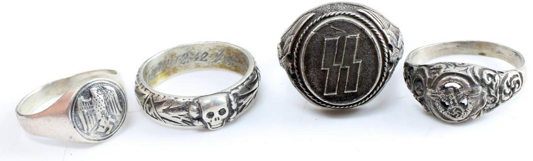 WWII GERMAN THIRD REICH SS HEINRICH HIMMLER RINGS: Lot of 4 rings from WWII Third Reich era: One .800 silver German national eagle men's ring size 10.5 measuring .5 inches in diameter, in good condition. One metallic SS men's ring size 12 measuring .7