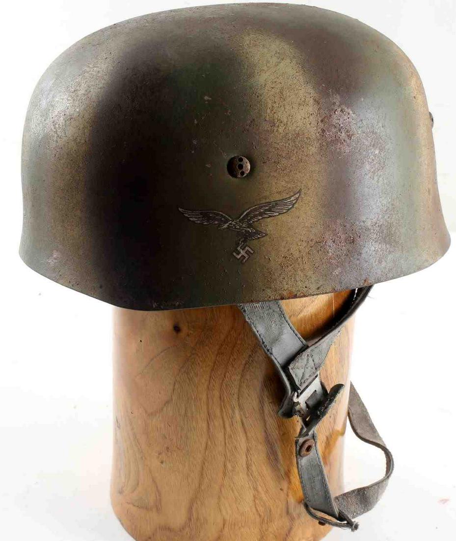 WWII GERMAN THIRD REICH M38 FALLSCHIRMJAGER HELMET: Luftwaffe Paratrooper helmet which has Inside liner marked "head width 60" "Steel shell number 68" and measures 7.5 inches in diameter. Includes straps, in worn condition. Helmet shows discoloration a