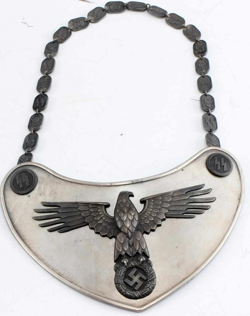 WWII GERMAN THIRD REICH GORGET SS 2ND PATTERN: Large SS 2nd pattern gorget with spread wing eagle. Gorget marked RZM M/128. Has correct stepped chain holders on the back. Complete with chain of alternating SS runes and skulls. Has all the characte