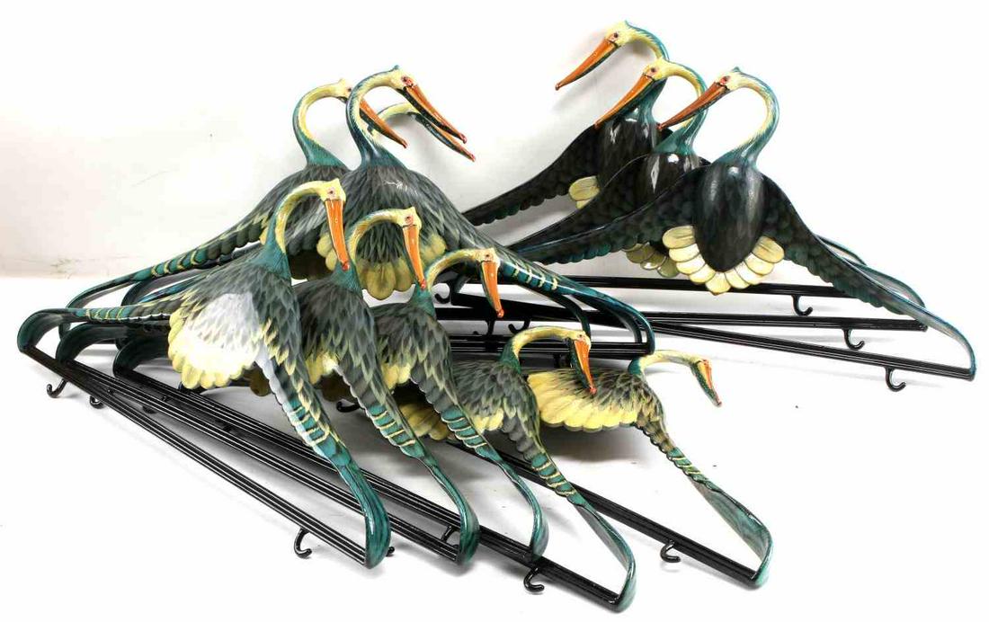 BLUE HERON VINTAGE LACQUER BIRD COAT HANGER LOT: Lot of 11 lacquer painted coat hangers. In overall good condition with some use wear and paint loss on pressure points. Width 17 inches, height 10 inches each.