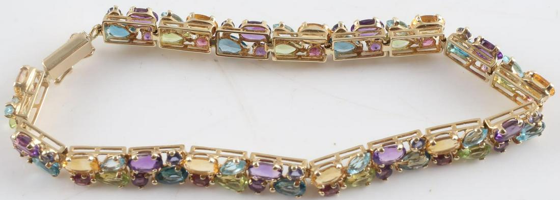 MULTI COLORED GEMSTONE BRACELET 14K GOLD BRACELET: 6.5 inches. Weighs 8.8 grams total. Stones measure 2 mm to 5 mm. Bracelet is in good condition. This lot has a reserve.