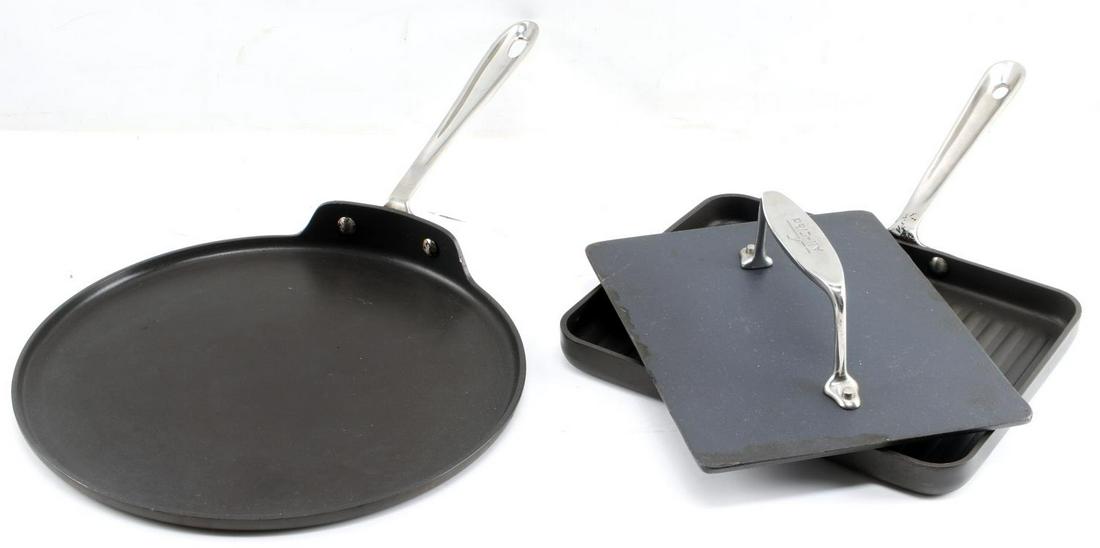 ALL CLAD PANINI PRESS AND CREPE FRYING PAN: All Clad Panini Bacon Press and Crepe Frying Pan. The panini press measures 11 inches by 9 inches. The crepe frying pan measures 12.5 inches in diameter. The lot shows signs of use but is in very good