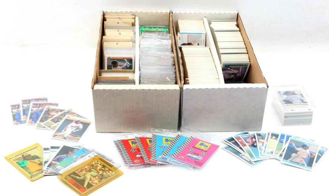 UNSEARCHED LOT OF FOOTBALL AND BASEBALL CARDS: Lot is of two boxes of Football, Basketball and NASCAR cards. There are many Rookie Cards in this lot such as an 86 Barry Bonds Rookie Card. Lot is in very good condition.