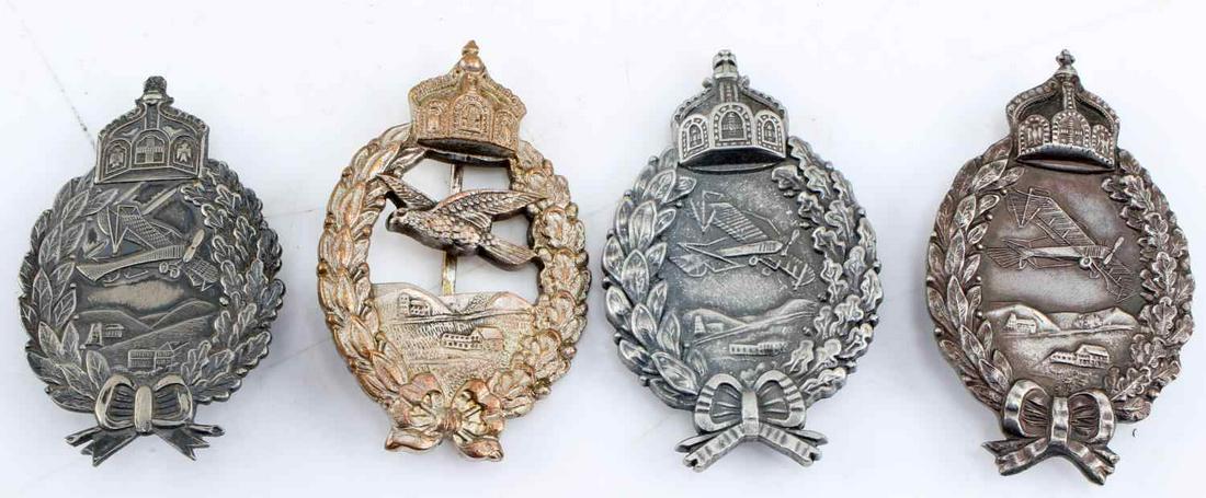 WWI IMPERIAL PRUSSIAN FLIGHT BADGES LOT OF FOUR: WWI Imperial Prussian Flight Badges Lot of Four. One silver flight badge composed of tin has a makers mark of "M9/50" on the vertical pin back. Another Silver Flight Badge has two makers mark on the r