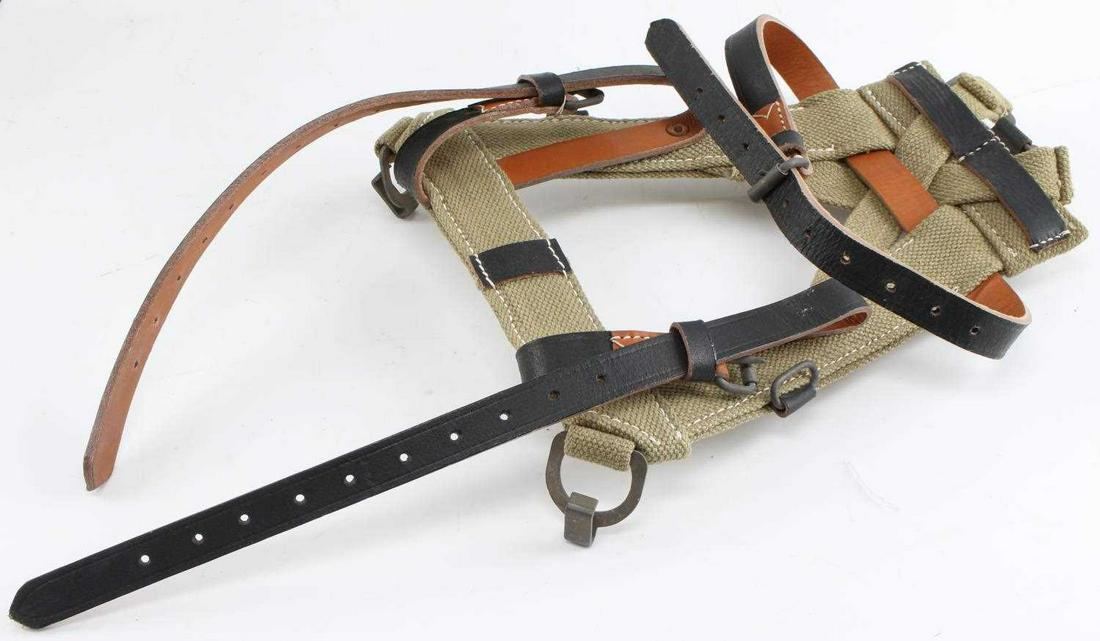 WWII GERMAN ARMY MILITARY COMBAT A FRAME BACKPACK: German WWII Army Military Combat Back Pack A Frame. 10 7/8” wide by 14” tall. Machine sewn tan canvas construction with three leather straps and four steel buckles. A scarce piece of field gear. V