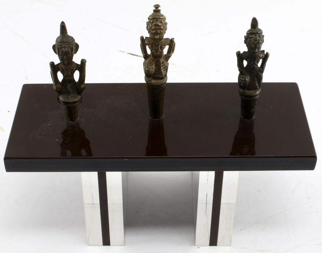 3 BRONZE BURMESE TATTOO NEEDLE TOP WEIGHTS: Antique top weights for tattooing needles with custom stand. Weights measure 3 inches to 3.5 inches. All in good condition. This lot has a reserve.