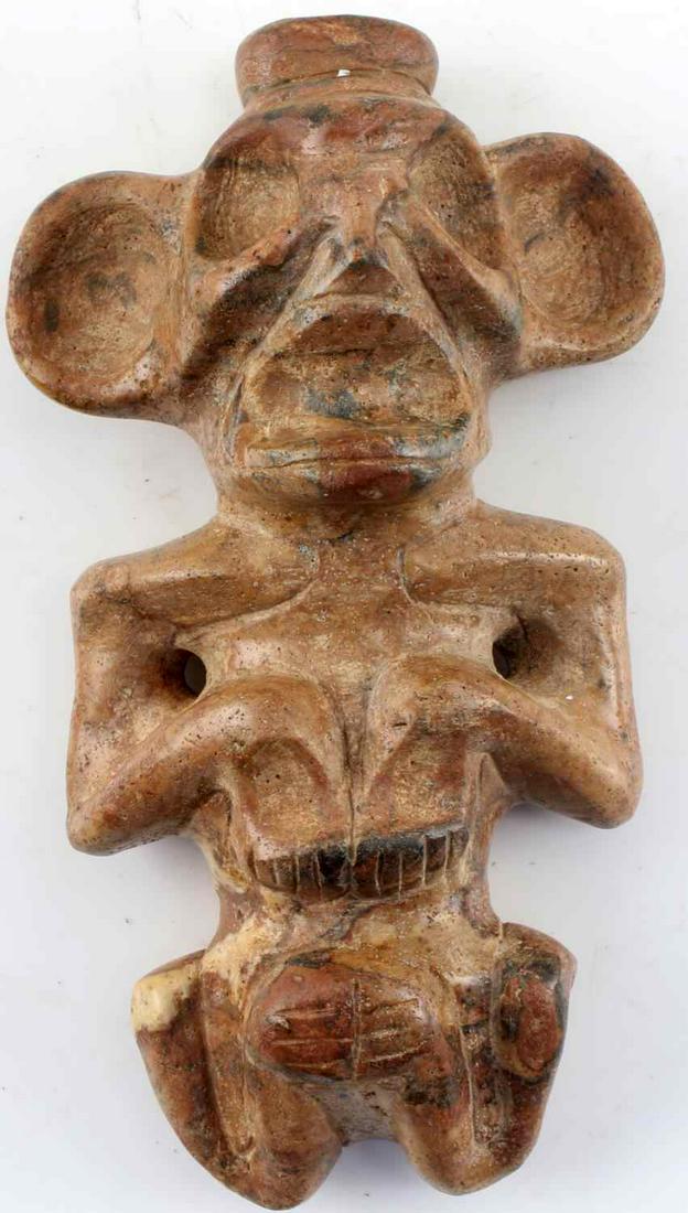 CARVED TAINO ANTHROPIC POINT OF FOCUS PENDANT: Birthing position and concentric triangles on back of head. Likely worn as a central theme for fertility ritual.1000-1500AD. Measures approximately 5 inches by 2.75 inches by 1.5 inches. Very good con