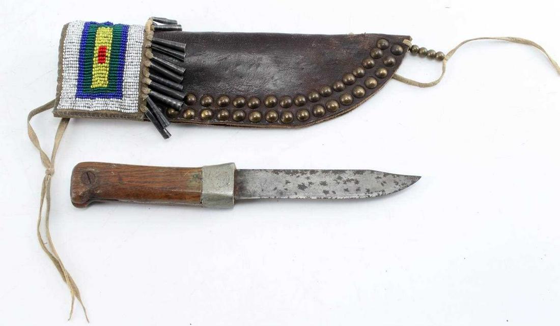 ANTIQUE PLAINS INDIAN KNIFE & BEADED SHEATH SCAB: Probably late 19th century early 20th century, beaded, cleated and conicals adorned with brain tanned leather, primitive hand made 9 1/2 overall length, sheath measures 10 inches.