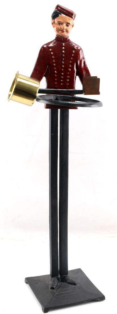 VINTAGE CAST IRON BELLHOP SMOKING ASHTRAY STAND: Missing brass plate, otherwise fine condition. Maker marked to back (Philp Morris 1927 Bierman Co.) Measures 30.5 inches tall.