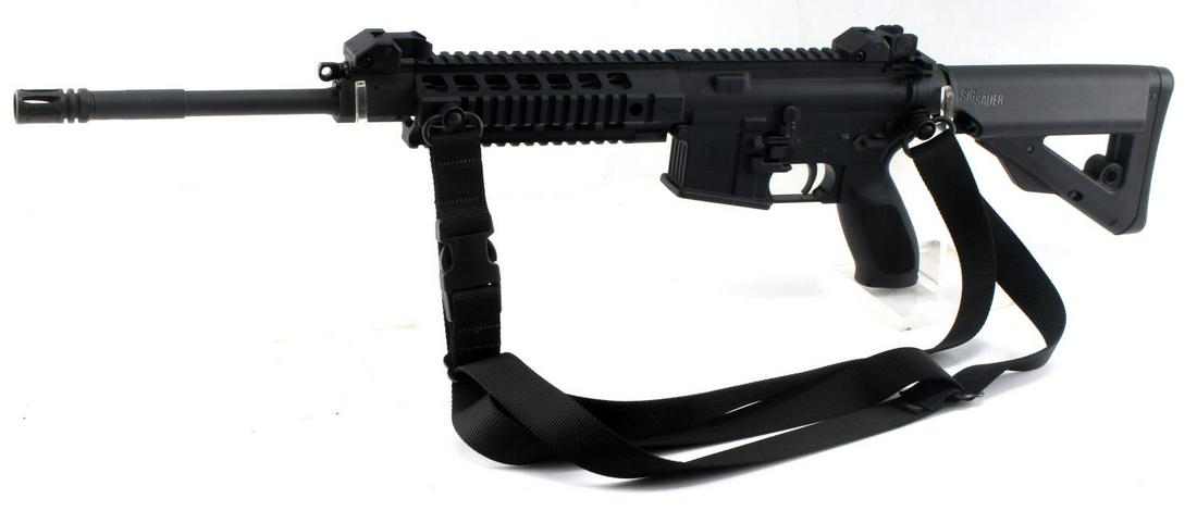 SIG SAUER SIG516 SEMI AUTO RIFLE 5.56 NATO BLACK: All black steel and polymer construction, maker, model, and serial number marked to left side, 5.56 Nato 1/7 marked to barrel end, picatinny rail system, barrel measures 17.5 inches with bright clean 