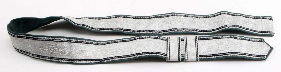 WWII GERMAN THIRD REICH WAFFEN SS PARADE BELT: WWII German Third Reich Waffen SS Parade Belt. Composed of green wool and silver bullion wire. Measures 36.5 inches long and 1.75 inches tall. Two belt loops. Very good condition. Unauthenticated; sol