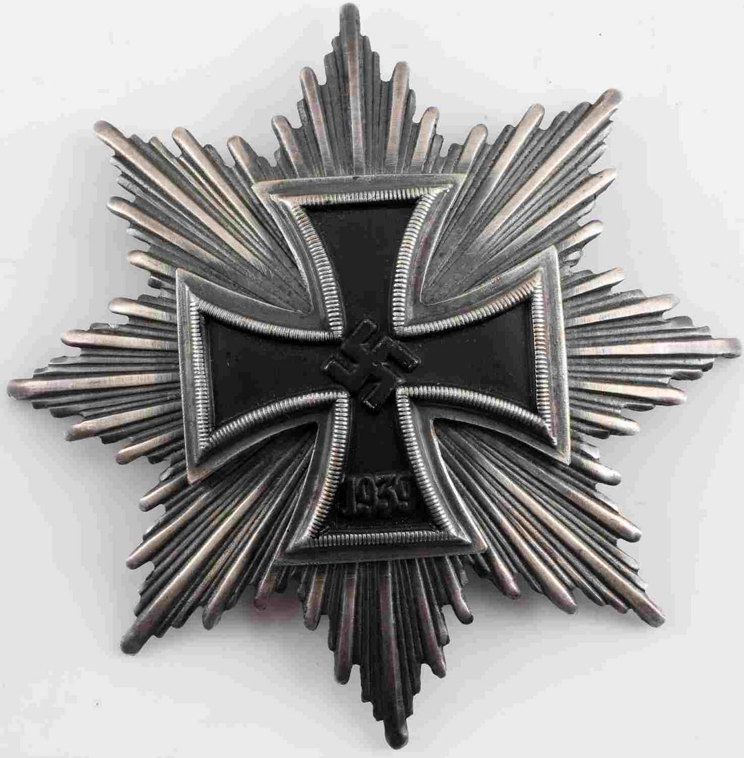 WWII GERMAN THIRD REICH STAR TO THE GRAND CROSS: WWII German Third Reich Star to The Grand Cross in Silver. Makers mark on the broad style pin back. "1939" on the Iron Cross. Some oxidation on the silver face. Measures 3.75 inches across. Very good