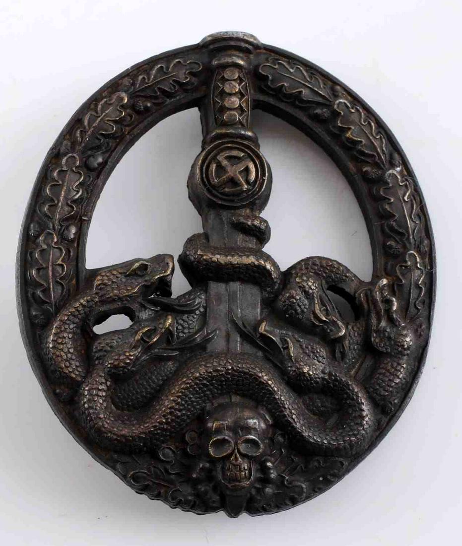 WWII GERMAN THIRD REICH ANTI PARTISAN WAR BADGE: WWII German Anti-Partisan War Badge in Bronze. Semi-hollow rear with flat, vertical pin back design. Finish loss on the front and rear. Very good condition.