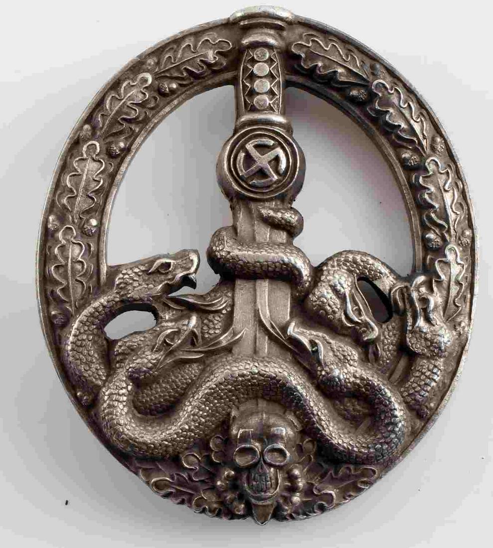 WWII GERMAN THIRD REICH SILVER ANTI PARTISAN BADGE: WWII German Third Reich Silver Anti-Partisan Badge. Semi-hollow rear with a vertical pin back design. Slight finish loss on the front of the badge. Awarded for 50 days of combat. Very good condition.