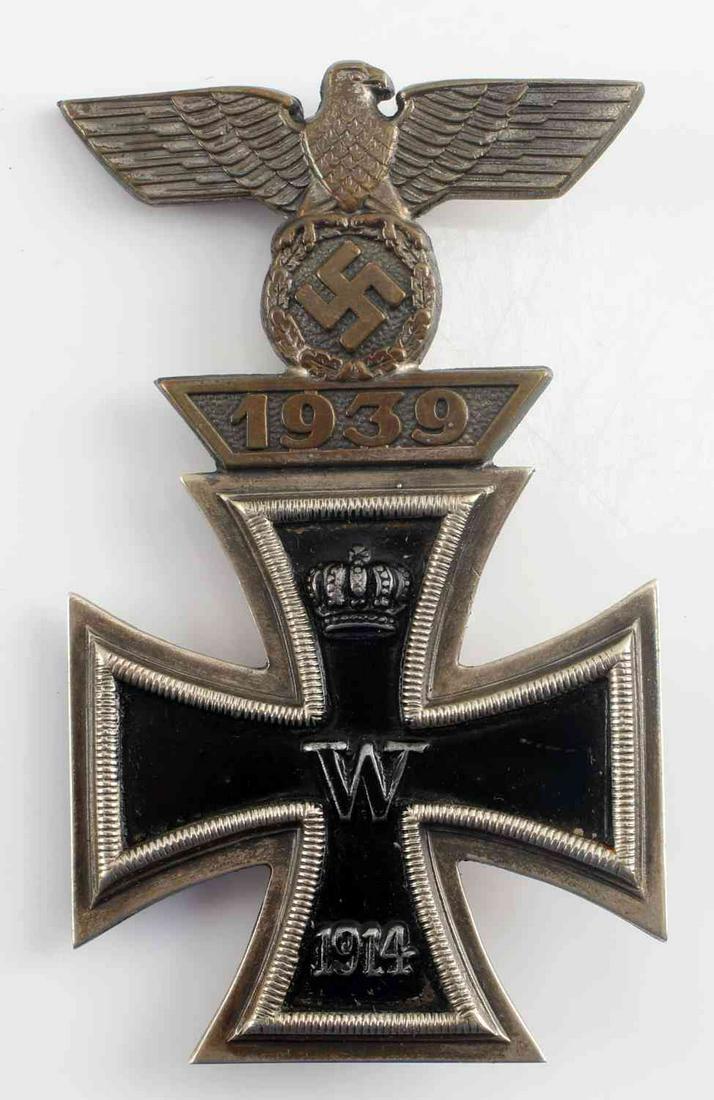 WWI IMPERIAL GERMAN IRON CROSS FIRST CLASS: WWI Imperial German Iron Cross First Class with WWII Spange First Class. Flat fertical pin back on the rear. Makers mark of "CE Junker Berlin SW". Marked "800" for silver. Nice oxidation on the rear.