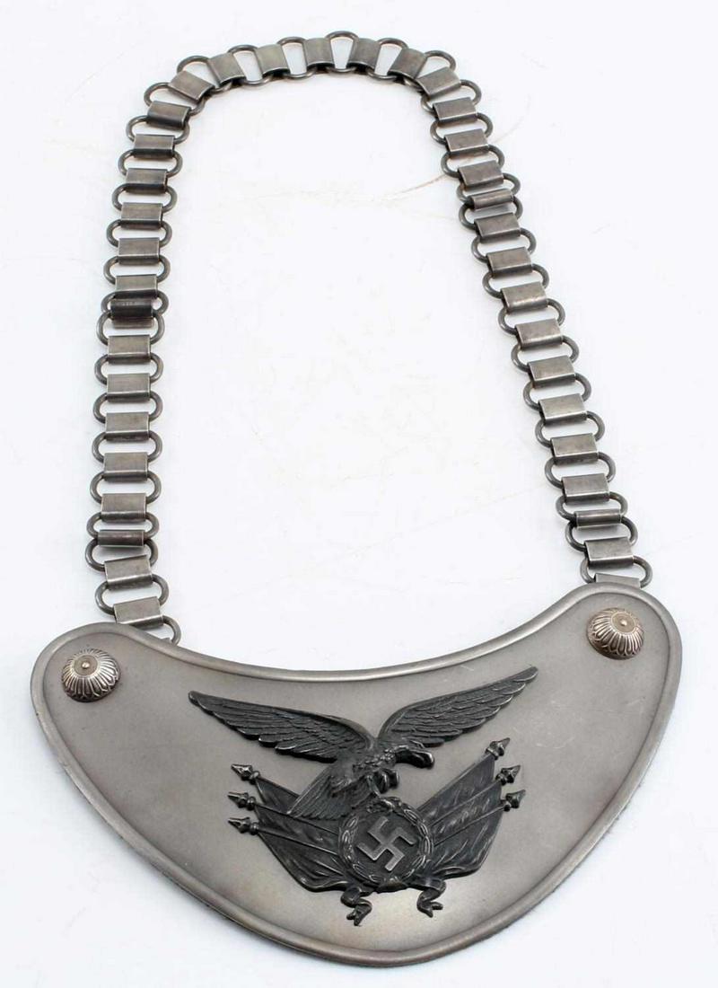 WWII GERMAN THIRD REICH LUFTWAFFE STANDARD GORGET: WWII German Third Reich Luftwaffe Standard Bearers Gorget. Makers mark of "C.E. Junker Berlin". Some wear but is complete with chain and cloth backing. Very good condition.
