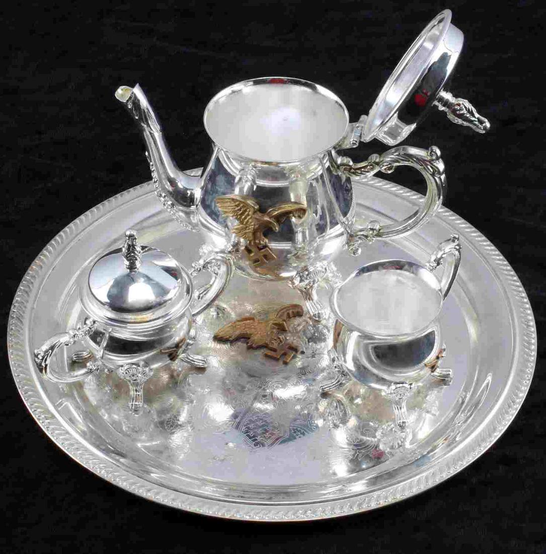WWII THIRD REICH GERMAN SERVING SET LUFTWAFFE: Four serving pieces from Lutwaffe pilot's canteen: Serving tray measuring 10 inches in diameter, creamer and sugar set measuring 2.5 inches in diameter by 2 inches high, coffee or tea pot measuring 5 