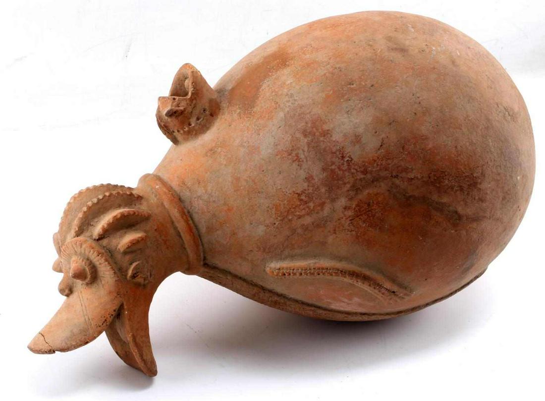 MOCHE ARYBALLOS ZOOMORPHIC POTTERY AMPHORA: Zoomorphic aryballos vessel measuring 16.5 inches by 8.5 inches. In good condition with a repair to mouth, tip of upper lip. This lot has a reserve.