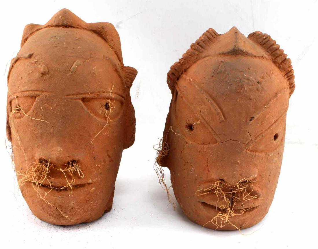 WEST AFRICAN NOK STYLE NIGERIAN TERRACOTTA HEAD: West African style terracotta head fragment. Nigeria, Nok culture, 20th century 9 3/4"h x 4 1/4"w x 5"d. West African style terracotta head fragment Nigeria, Nok. 10"h x 4"w x 5 1/4"d. This lot has a