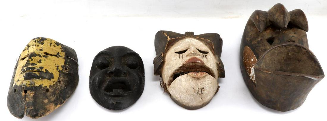LOT 4 AFRICAN CEREMONIAL DANCE & PASSPORT MASKS: One Dan Complex Kagle mask. Measures 10.25 inches by 6.25 inches by 5.5 inches. Some paint loss. One Elu mask with movable jaw measuring 7.5 inches by 6 inches by 4 inches. Some paint loss. Small blac