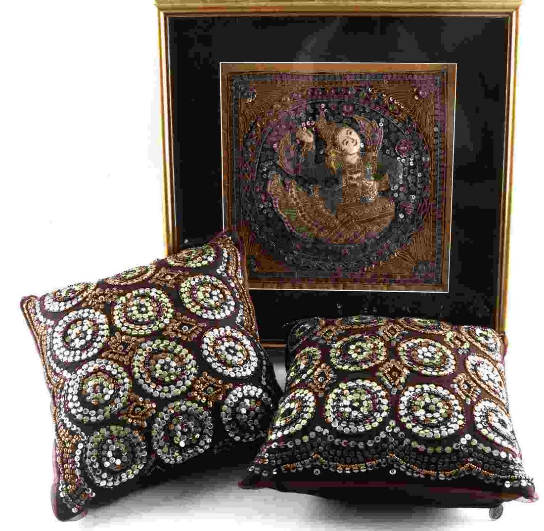 THREE DIMENSIONAL TEXTILE BALINESE DANCER PILLOWS: One framed three dimensional, sequined, textile art depicting Balinese dancer, with a focus on gold and lavender color tones. The textile piece measures 11 inches by 11 inches, and the frame is 17 inc