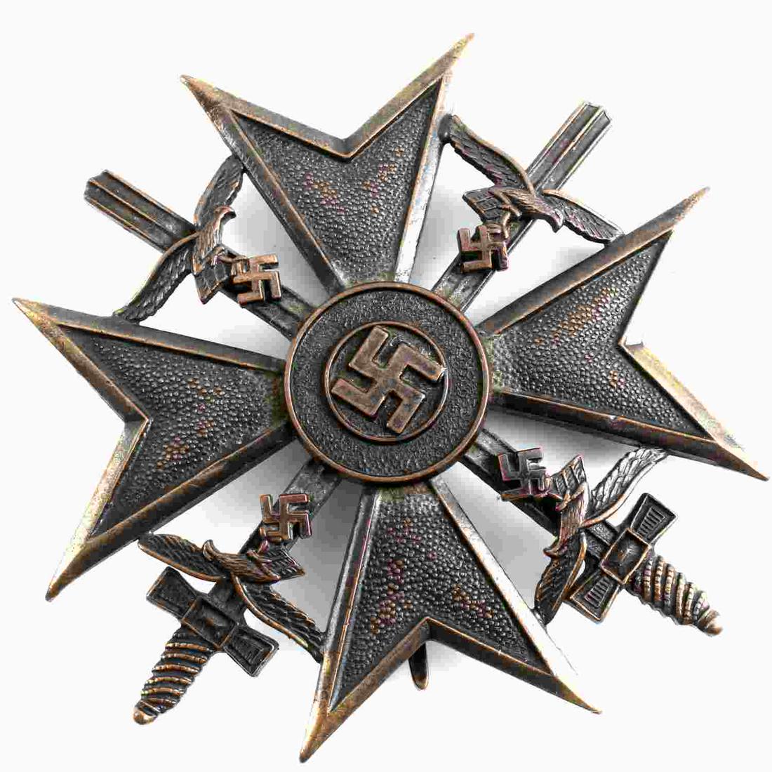 WWII THIRD REICH SPANISH CROSS IN BRONZE TYPE A: Cut out Swastika detail with swords measuring 2.5 inches by 2.5 inches. Broad pin structure marked "CEJ" on back.