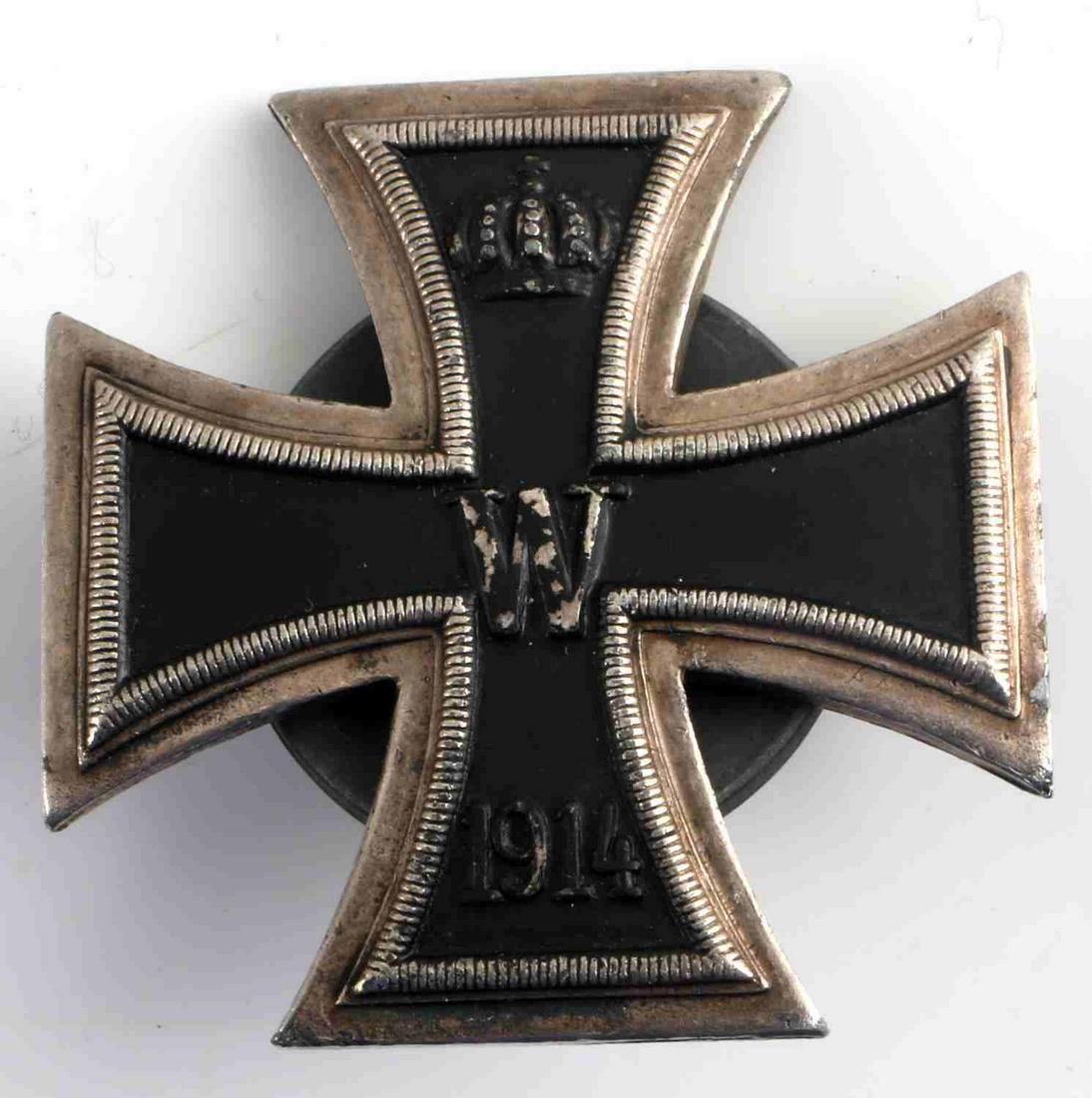 WWI IMPERIAL GERMAN IRON CROSS FIRST CLASS: WWI Imperial German Iron Cross First Class. Screwback with makers mark of "J.Knedler". Screwback is stamped "Warzawa UL NOWY SWIAT45".Slight patina to the rear of the cross. Very good condition. Unaut