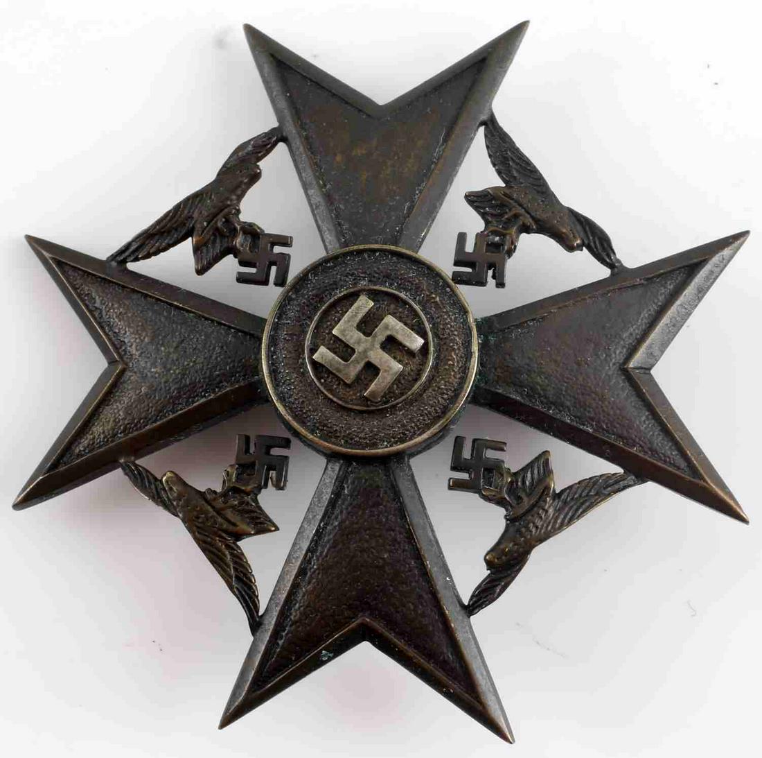 WWII GERMAN THIRD REICH SPANISH CROSS IN BRONZE: WWII German Third Reich Spanish Cross without Swords in Bronze. Makers mark of "CEJ" for CE Junker Berlin. Flat, vertical pin back. Slight oxidation on the front of the badge. Very good condition.