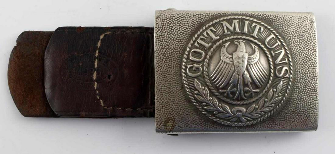 WWI IMPERIAL GERMAN BELT BUCKLE WITH LEATHER TAB: WWI Imperial German Belt Buckle with Leather Tab. Makers mark on the leather tab. "GOTT MIT UNS" stamped on the buckle. Wear on leather and buckle is present. Very good condition. Unauthenticated; sol