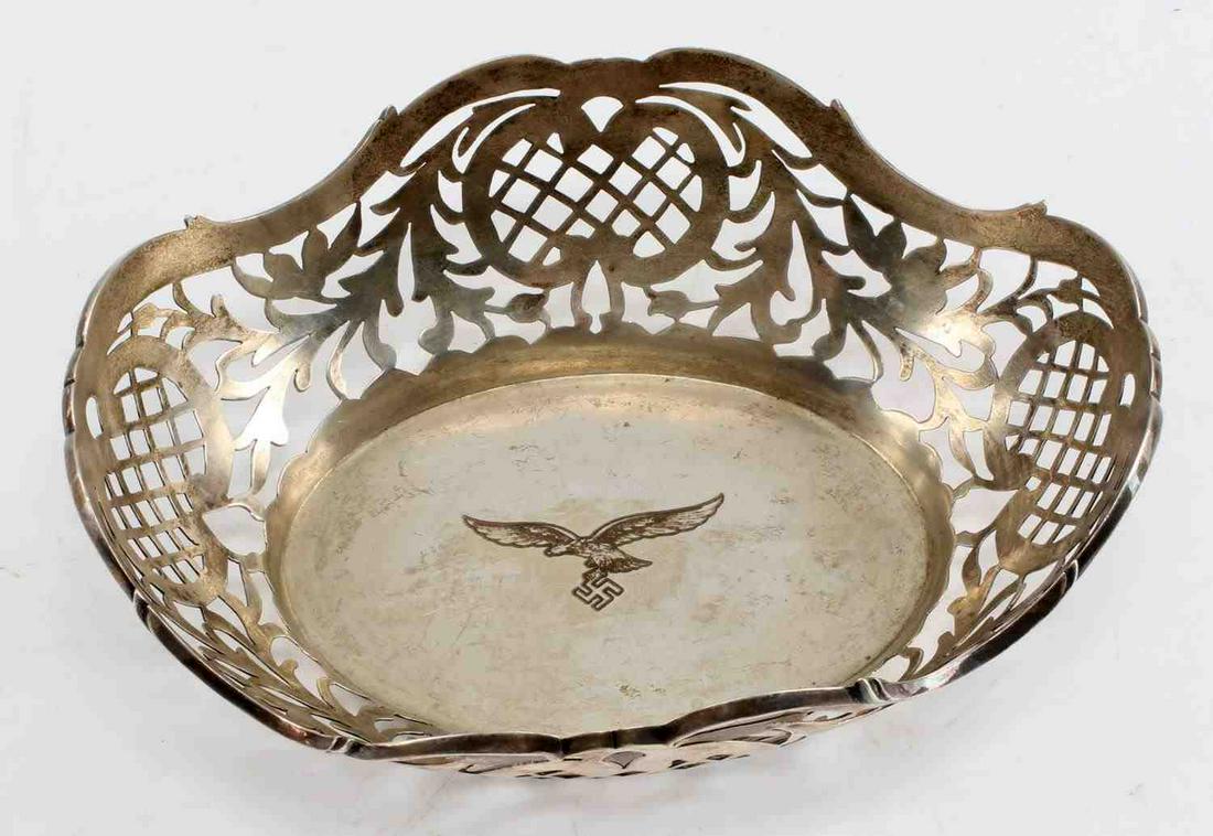 WWII GERMAN THIRD REICH LUFTWAFFE PILOT BOWL: WWII German Third Reich Luftwaffe Pilot Bowl. Marked "800" for silver. Makers mark of "Gebr. Friedlaender". Measures 6.5 by 5.25 by 2.25 inches. Slight patina to the bowl. Luftwaffe eagle in the cente