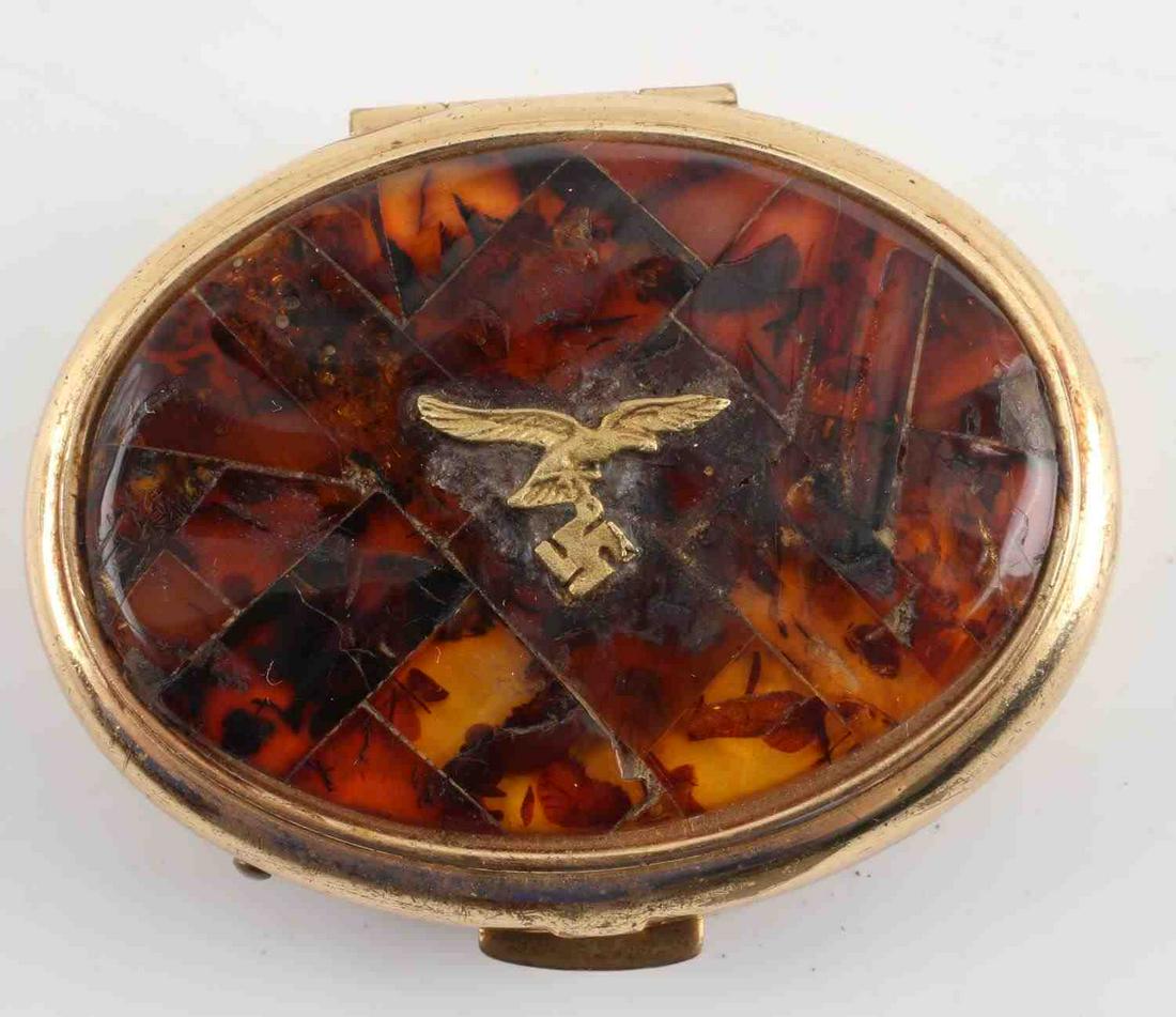 WWII THIRD REICH GERMAN LUFWAFFE AMBER PILL BOX: Luftwaffe pilot wife's pill box with amber colored lid measuring 2 inches by 1.75 inches. Unauthenticated, sold as is. This lot has a reserve.