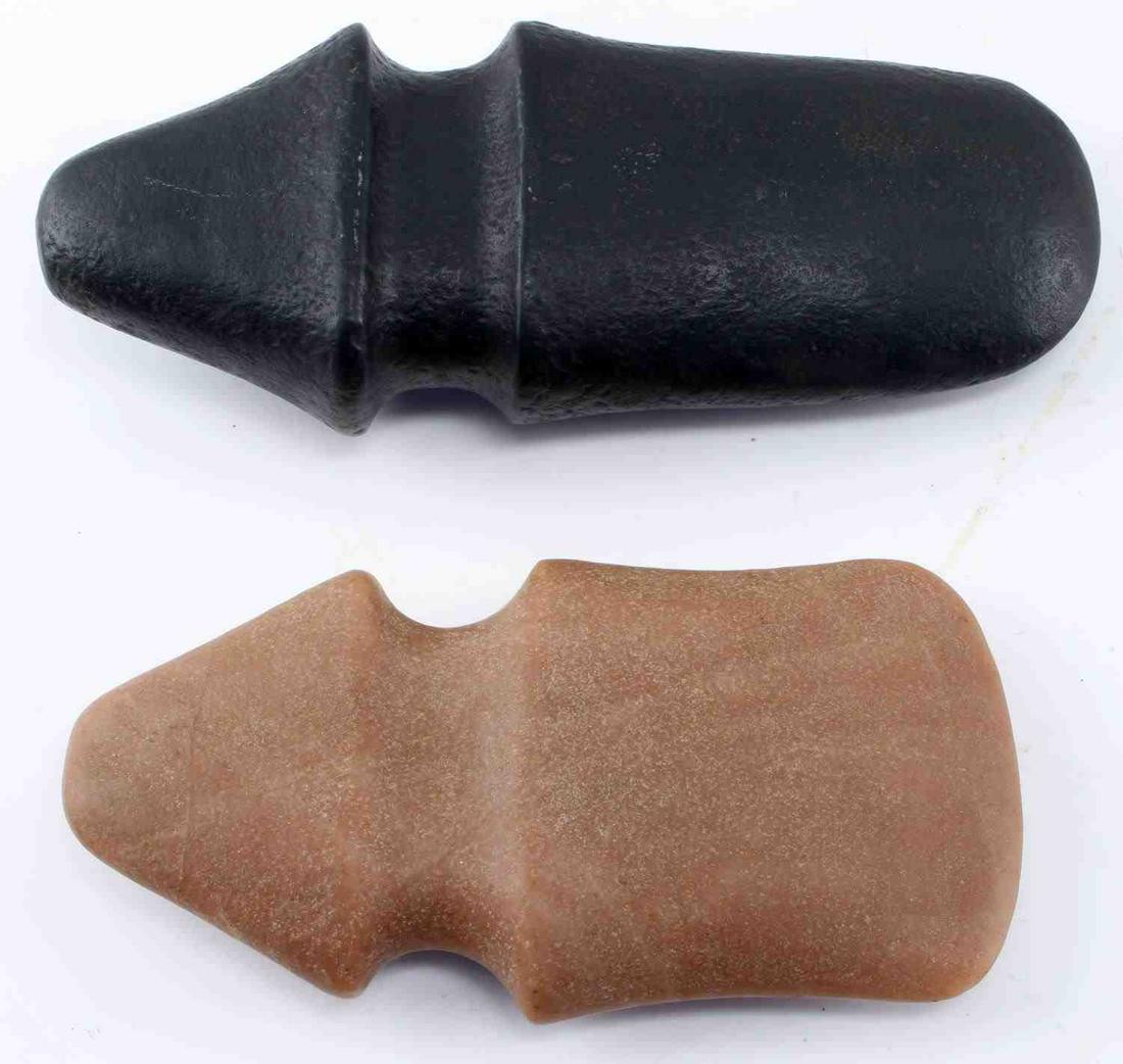 NATIVE AMERICAN FULL GROOVE STONE AXE HEAD: Illinois/Missouri region full groove stone axe heads. Black stone 7 3/4 inches in length with a 3 inch with. Brown stone 6 1/2 inches in length with 3 3/8 inch width. Unauthenticated sold as is.