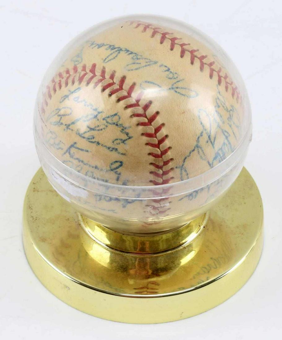 1948 CLEVELAND INDIANS CLUBHOUSE TEAM SIGNED BASEBALL: 1948 World Series Champs Cleveland Indians Clubhouse Team Signed Baseball. Features the signatures of Bob Feller, Eddie Robinson, Joe Tipton, Bob Kennedy and Satchel Paige. The Satchel Paige signature