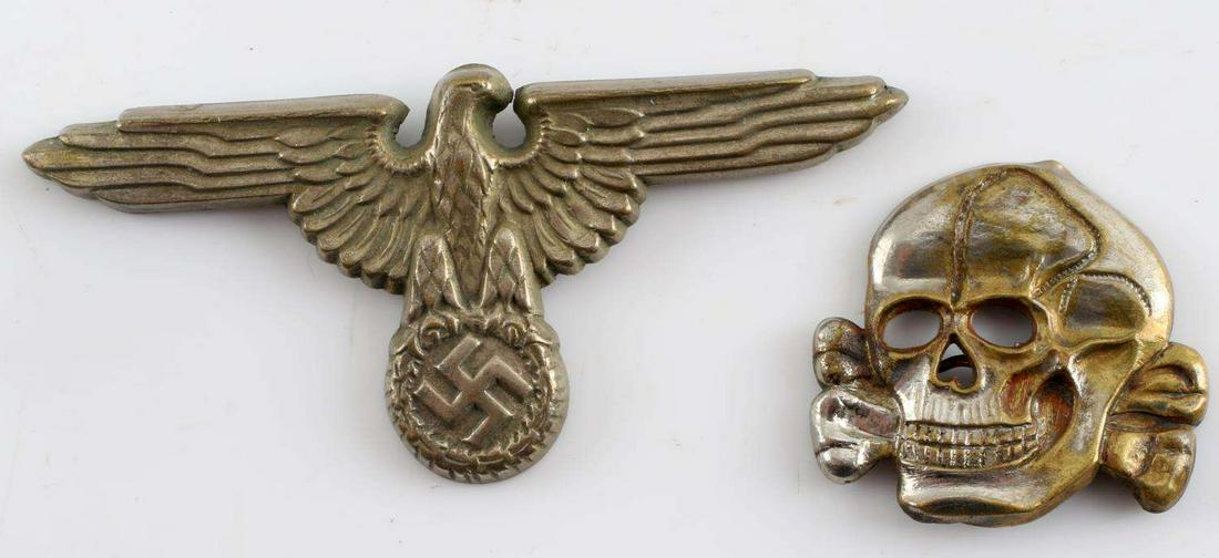 WWII GERMAN THIRD REICH SS VISOR EAGLE & TOTENKOPF: WWII German Third Reich Waffen SS Officer Cap Eagle and Totenkopf. Eagle marked “RZM” “M1/17” on back and “800” on top of wing. Skull marked “RZM M1/52” on back and “800” on bottom