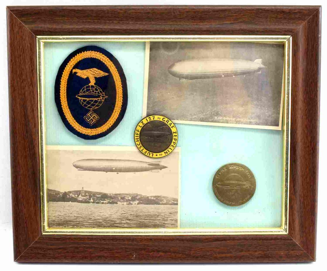 FRAME OF WWII GERMAN GRAF ZEPPELIN BADGES PATCHES: Frame measuring 12 by 10 inches with 2 post cards, crew shoulder patch, 2 LZ 127 badges, all original and very good.