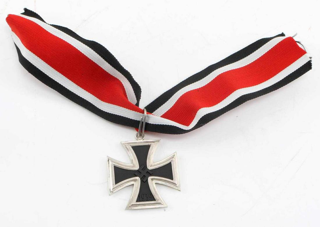 WWII THIRD REICH GERMAN SILVER KNIGHTS CROSS: WWII German Knight's cross and ribbon with real silver frame and magnetic iron center. The top edge of cross is marked 800 and has an upside down 4, which signifies Steinhauer 7 luck. Unauthenticated,