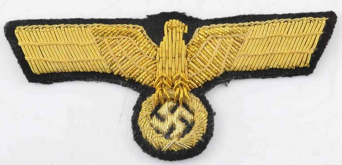 WWII GERMAN WEHRMACT PANZER GENERAL BREAST EAGLE: Yellow gold bullion over black wool with paper backing. Measures 4 inches long. Very good condition. This lot has a reserve.