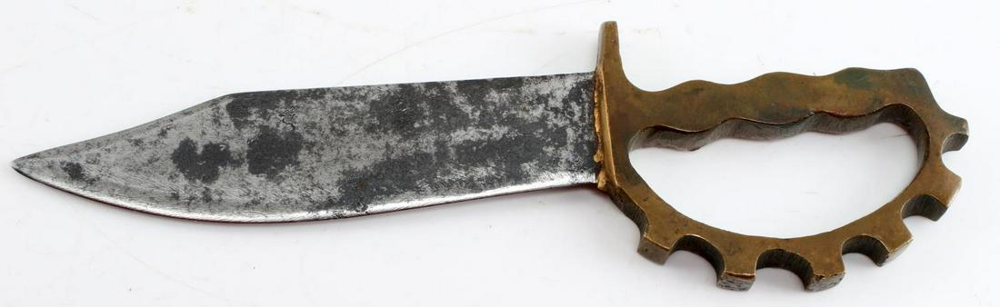 WWII AUSTRALIAN RANGER COMMANDO KNUCKLE DUSTER: WWII Australian Ranger Commando Knuckle Duster Trench Knife. The blade measures approximately 6 inches. The handle measures 4 inches by 3 inches. Strong pitting on the blade. No makers mark. Very good