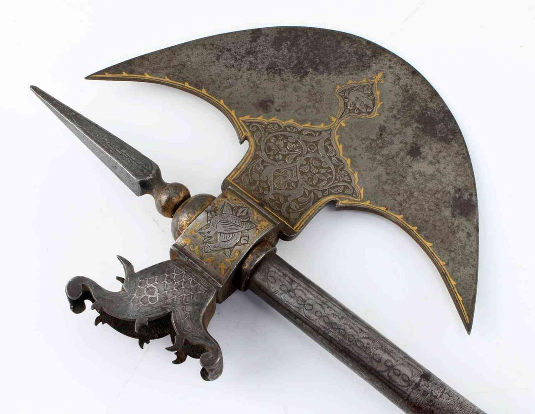 INCISED 17TH CENTURY BARDICHE POLEAXE AXE: Possible stylized dragon back of blade, style of headwear on male suggest Italian decorated, extensively decorated, retains much of the original gilt, overall length is 32.5 inches.