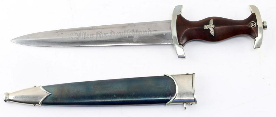 WWII GERMAN THIRD REICH NSKK DAGGER WITH SCABBARD: WWII German Third Reich NSKK Dagger with Scabbard. Makers mark of "Kuno Ritter Solingen". Blade is etched "Alles fur Deutchland". The dagger measures 14 inches. The crossguard is marked "S". Anodized 