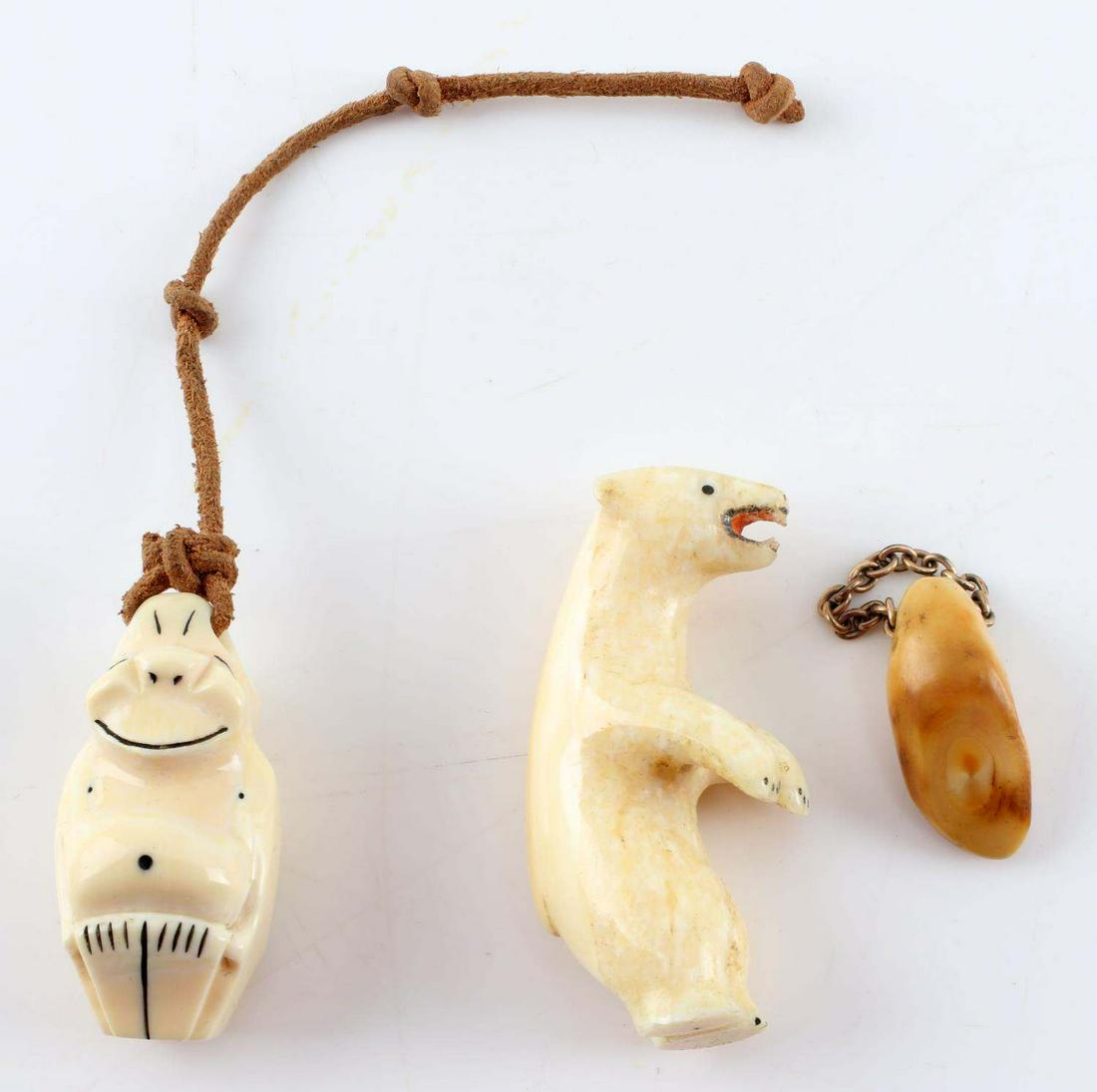 INUIT ESKIMO POLISHED WALRUS TUSK BEAR & BILLIKIN: Inuit Eskimo Polished Bone Carved Figurine Effigy. The lot includes one Polar Bear effigy that measures 2.25 inches tall, one dimorphic dual sex Billikin effigy with a male on one side and a female no
