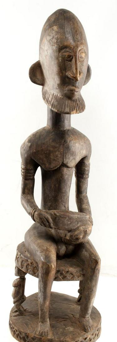 DOGON WEST AFRICA MALI TRIBAL ANCESTOR STATUE: Antique wooden male ancestor sculpture. Dogon culture, Mali, West Africa. Height 33, diameter 10 inches. In good condition This lot has a reserve.