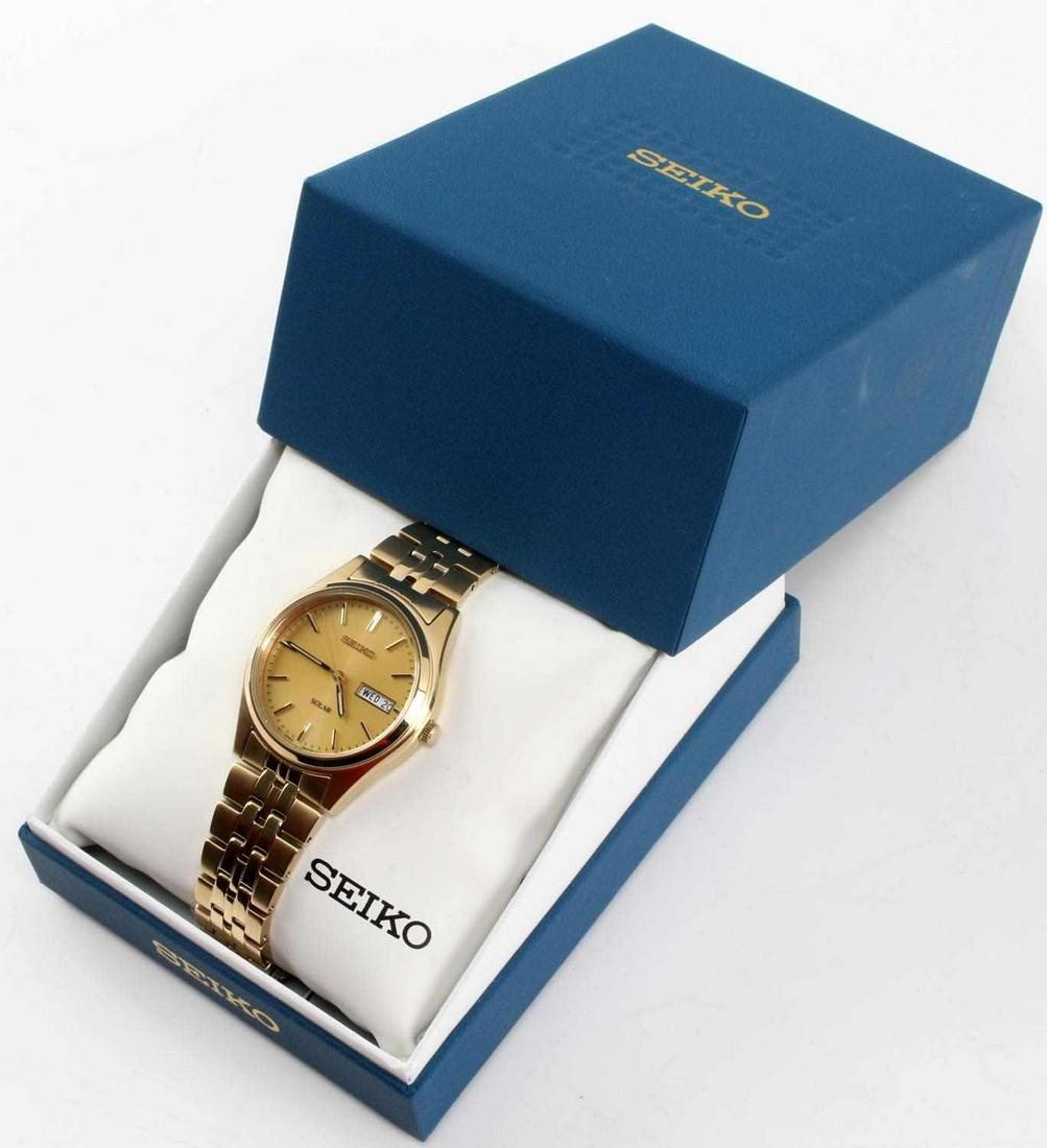 SEIKO SOLAR V158-0AA0 GOLD TONE WRIST WATCH: Seiko Solar V158-0AA0 Gold Tone Wrist Watch. Water resistant and composed of stainless steel. The band is marked "L" and "444KL" Suggested retail is $215.00.