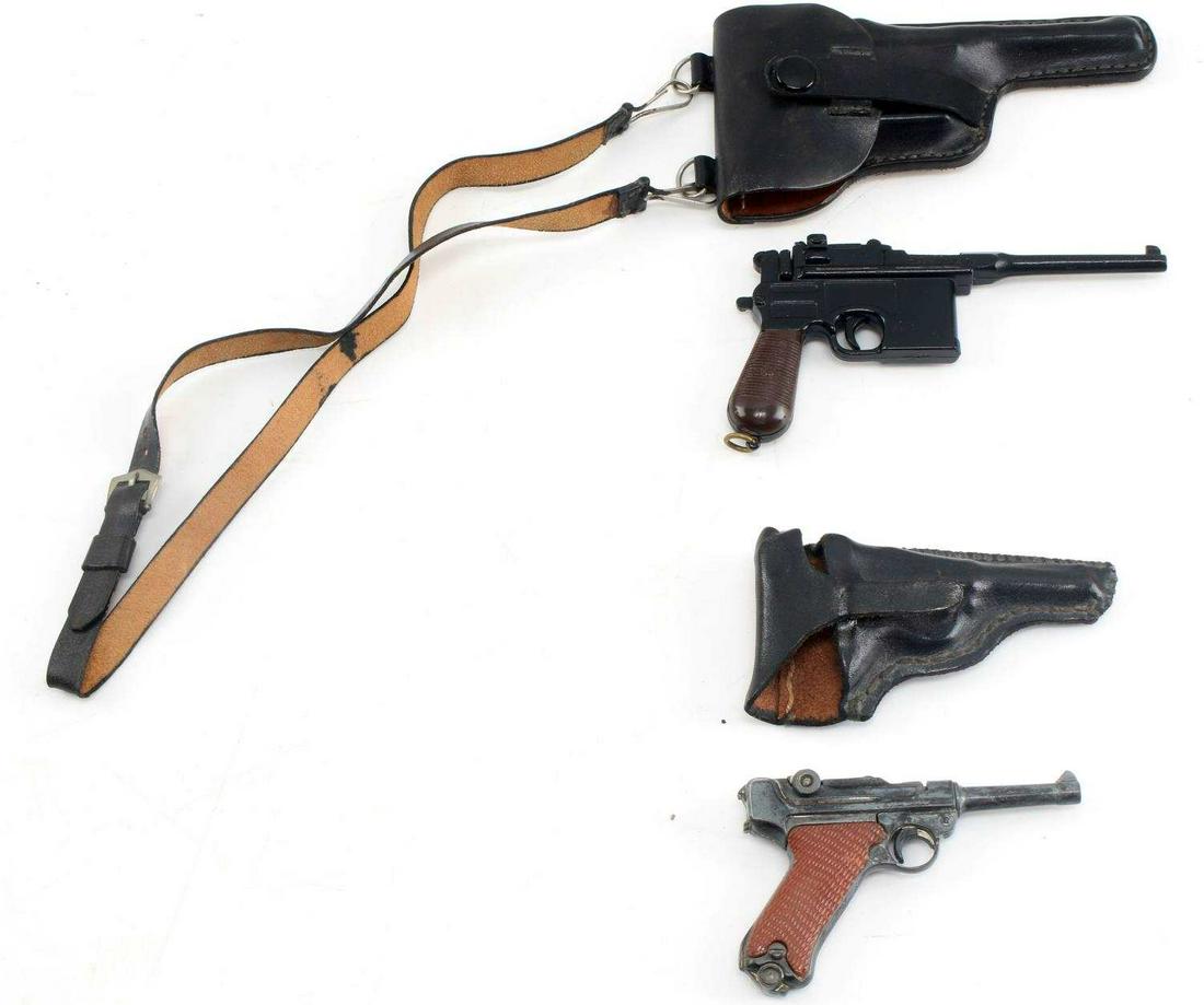 WWII GERMAN MAUSER AND LUGER MINI REPLICA LOT OF 2: WWII German Mauser and Luger Miniature Replica Lot of Two. The Mauser is marked "Uniwerk Italy" and "Tipo Mauser 7.63". The trigger and hammer on the replica are in working order. The Luger is marked 