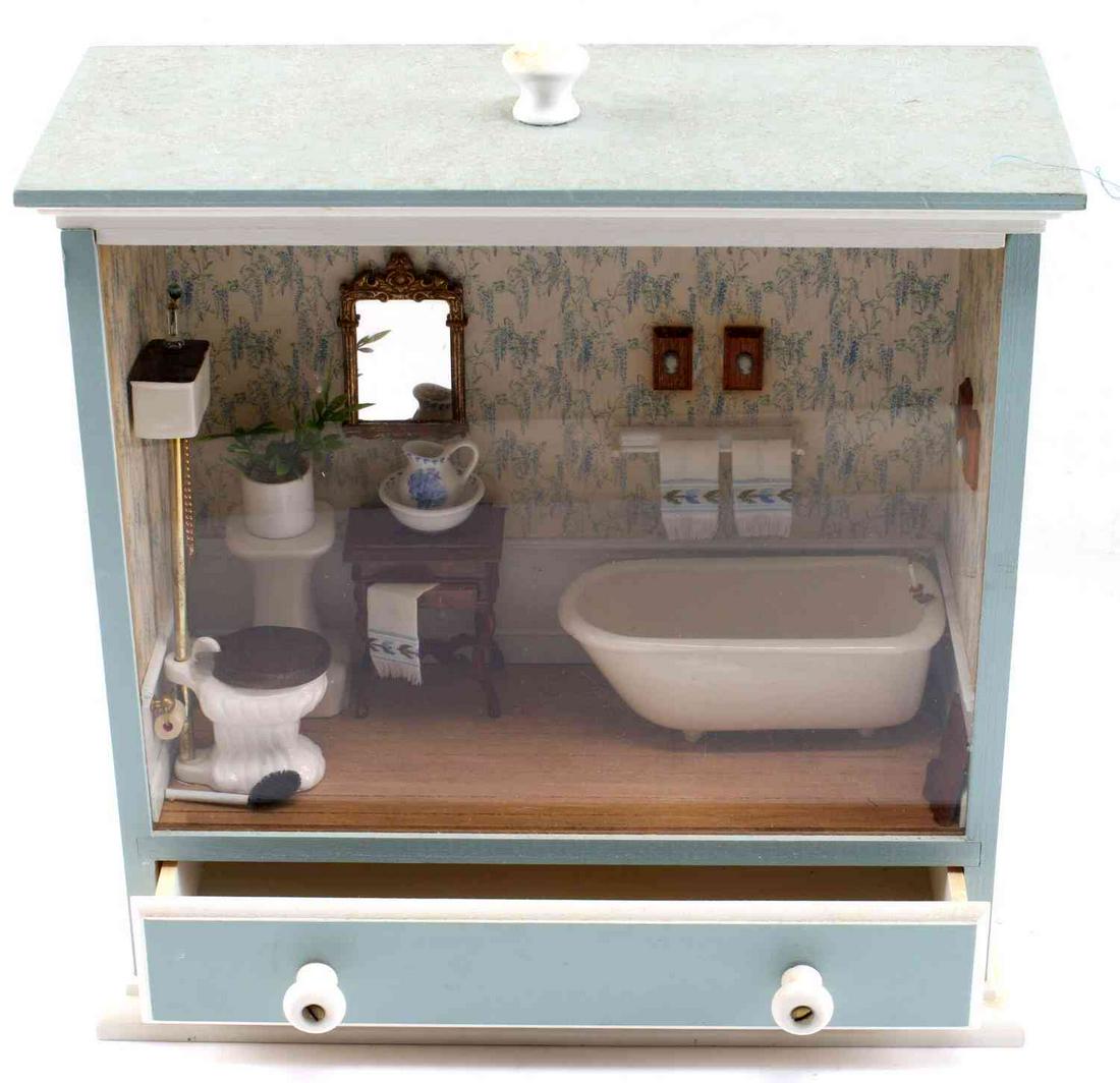 TURN OF THE CENTURY BATHRROM DIORAMA HANGING: Bathroom diorama, including 2 hanging screws, measuring 11 inches by 11 inches. The bottom drawer of this piece opens, and the bathroom accessories include toilet paper, toilet brush, three towels, fo
